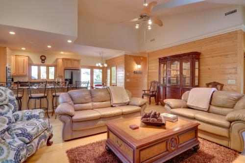 a living room with two couches and a table at 11 Mi to Ski Sapphire Heaven South Apt with Porch in Highlands