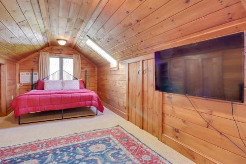 a small room with a bed and a flat screen tv at 11 Mi to Ski Sapphire Heaven South Apt with Porch in Highlands