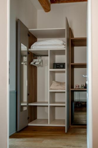 a room with a bunk bed and a closet at Neoclassico by Tiziana Monaldi in Pitigliano