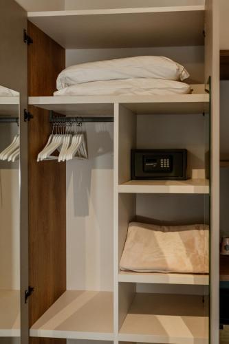 a bedroom with a bed and a bunk bed at Neoclassico by Tiziana Monaldi in Pitigliano