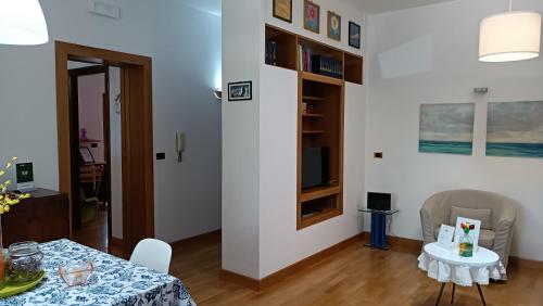a living room with a table and a dining room at La casa di Panfilo in Sulmona