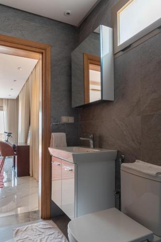 a bathroom with a sink and a toilet at villa with views in Agadir