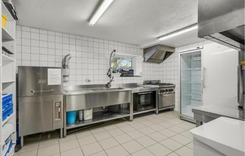 a kitchen with a sink and a stove at 11 Bedroom Cozy Home In Gørding in Gørding