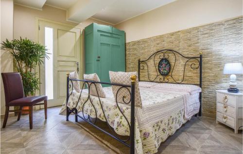 a bedroom with a bed and a green cabinet at Prato Bello in Fucecchio