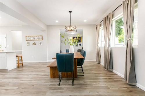a kitchen and dining room with a table and chairs at Victory Villa - 5 BR Home 5 Min From Campus in South Bend