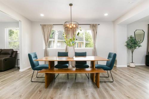 a dining room with a table and chairs at Victory Villa - 5 BR Home 5 Min From Campus in South Bend