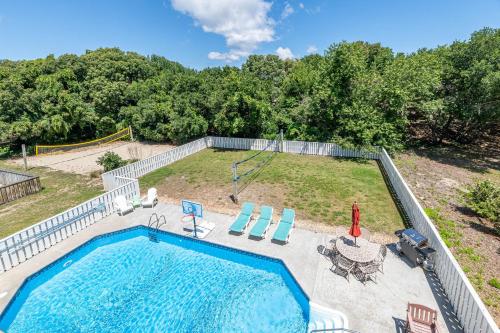 an overhead view of a swimming pool with a playground at Family Tradition in Duck