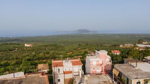 an aerial view of a small town with houses at Panorama Sea View Residence in Gargaliánoi