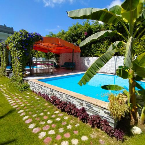 Gallery image of Two pools four bedrooms private villa in Qaryat Shākūsh