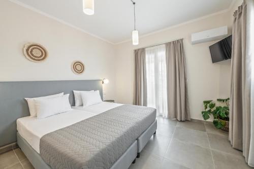 Una cama o camas en una habitación de Garden Studios