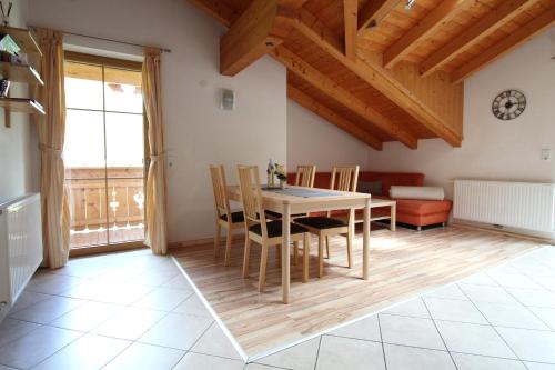 a kitchen and dining room with a table and chairs at Landhaus Müller in Neustift im Stubaital