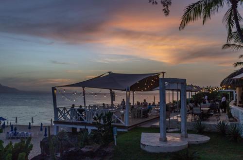 a wedding reception at the beach at dusk at Bungalow #5 in Playa Alicia Sosua Puerto Plata in Sosúa