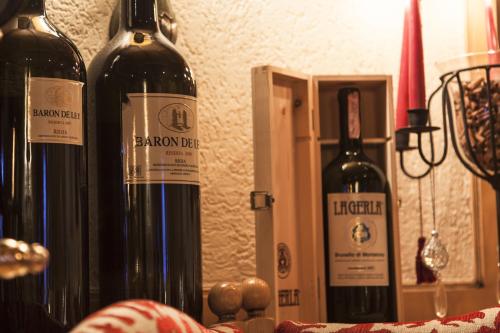 three bottles of wine sitting on top of a table at Hotel Kristall in Sankt Anton am Arlberg