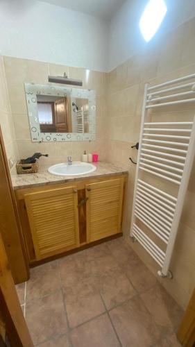 a bathroom with a sink and a mirror at La Tana in Morgex