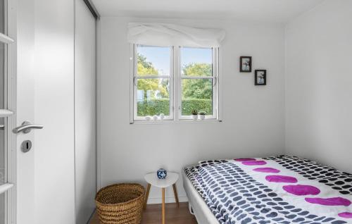 a white room with a bed and a window at 3 Bedroom Amazing Home In Svendborg in Svendborg