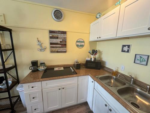 a kitchen with a sink and a counter top at Unit 125 at Park Place in Cedar Key, FL in Cedar Key