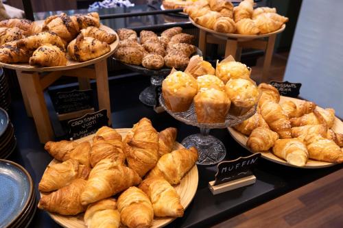 a bakery with various types of pastries on display at Hotel Indigo Turin by IHG in Turin