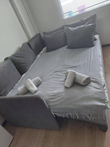 a large bed with two pillows on top of it at Nova #7 in Sofia