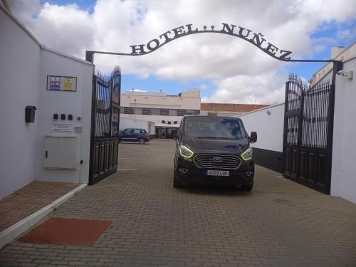 a small car is parked in a parking lot at Nuñez Tomelloso in Tomelloso
