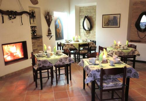 a restaurant with tables and chairs with candles on them at B&B I Prati di Varmo in Romans di Varmo