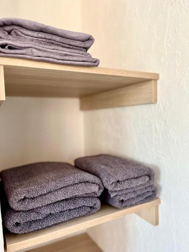 a bunch of towels are sitting on a shelf at Volna in Odesa