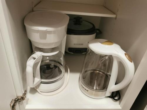 a coffee maker and a blender in a drawer at Fun Games and Spacious 4BR House 3 ML to Lackland AFB close to SeaWorld in San Antonio