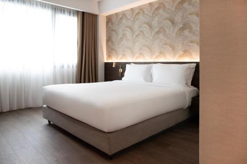 Un ou plusieurs lits dans un hébergement de l'établissement Luwian Athens Boutique Hotel