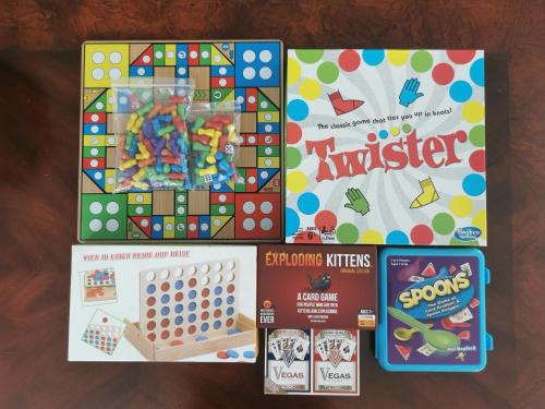 a group of games and toys on a table at Fun Games and Spacious 4BR House 3 ML to Lackland AFB close to SeaWorld in San Antonio