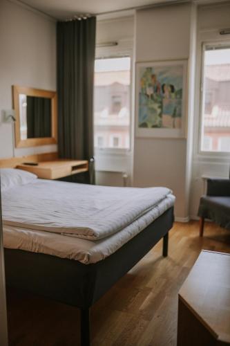 Ένα ή περισσότερα κρεβάτια σε δωμάτιο στο Comfort Hotel Jazz, Borås