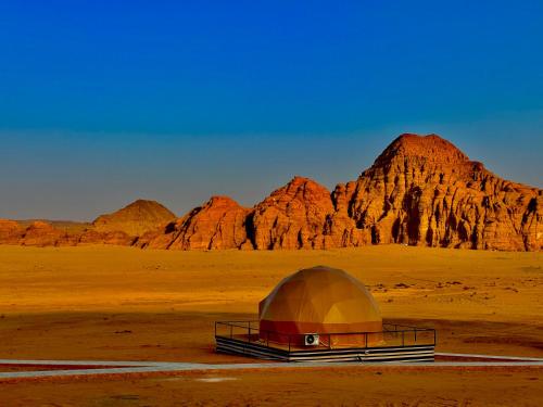 a dome tent in the middle of the desert at Tulip Camp Wadi Rum in Wadi Rum