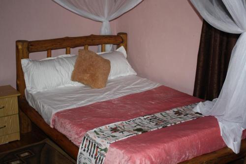 Bulbul safaris Lodgeにあるベッド