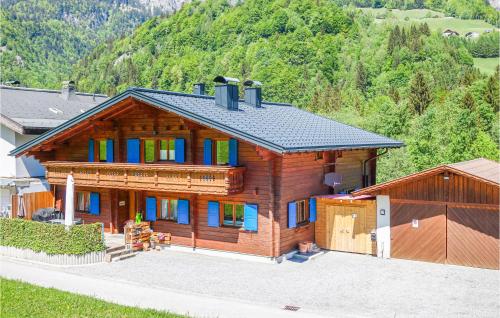 a large wooden house with blue windows at Moderne Ferienwohnung-Dalaas in Dalaas
