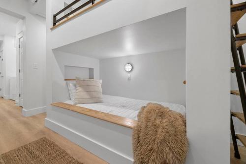 a white room with a bed in a room at Maia - 109 Ridge Lane in Branson