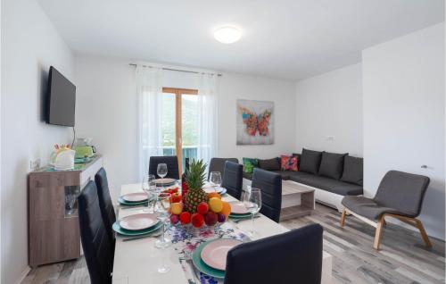 a living room with a table with fruit on it at Beautiful Home In Kostanje With Wifi in Kostanje