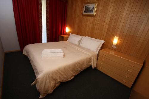 Säng eller sängar i ett rum på Residence Les Coupoles