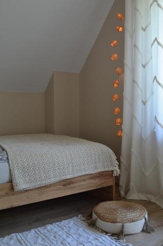 a bedroom with a bed and a window at Leśny Zakątek Kownatki 42 in Kozłowo