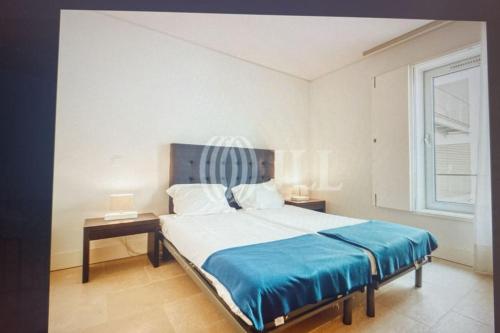 Ένα ή περισσότερα κρεβάτια σε δωμάτιο στο Troia apartment at the longest white sand beach
