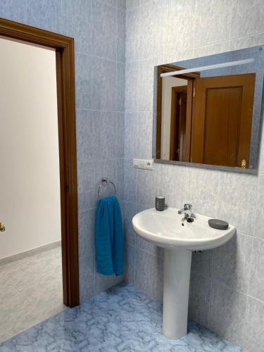 a bathroom with a sink and a mirror at Casa turística Lucena in Vilagarcia de Arousa