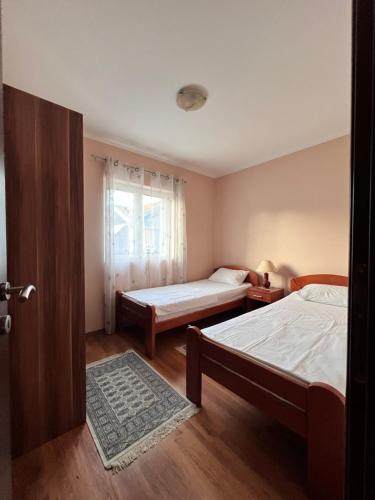 Postel nebo postele na pokoji v ubytování Sunshine Apartment