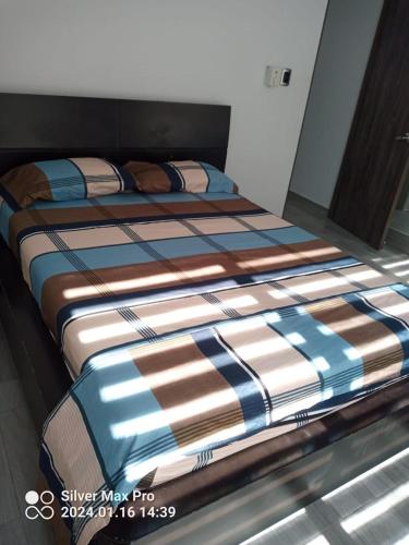 a pair of beds sitting in a room at Casa de descaso en Carmen de apicala in Carmen de Apicalá