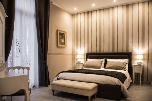 เตียงในห้องที่ Dolci Mura Luxury Rooms