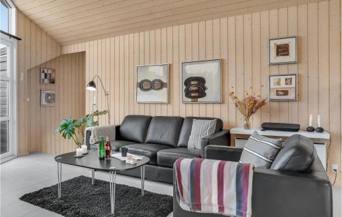 a living room with a couch and a table at Beautiful Home In Otterup With Wifi in Otterup