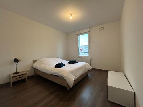 Ένα ή περισσότερα κρεβάτια σε δωμάτιο στο Grand T3 spacieux