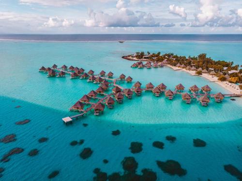 an aerial view of a resort island in the ocean at InterContinental Bora Bora Le Moana Resort by IHG in Bora Bora