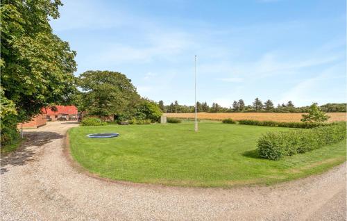 a field with a blue frisbee in the grass at Awesome Home In Bedsted Thy in Bedsted Thy