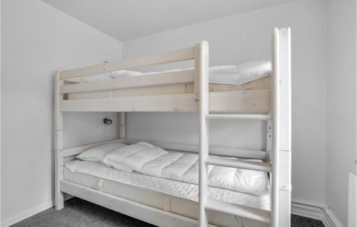 a couple of bunk beds in a room at Awesome Home In Bedsted Thy in Bedsted Thy