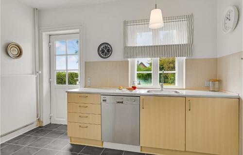 a kitchen with a sink and a dishwasher at 3 Bedroom Nice Home In Kværndrup in Kværndrup