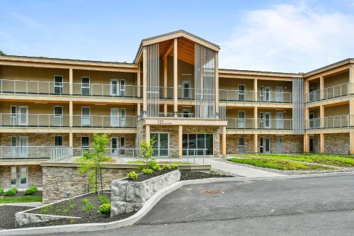 an empty parking lot in front of a building at Lago by Tremblant Platinum in Mont-Tremblant