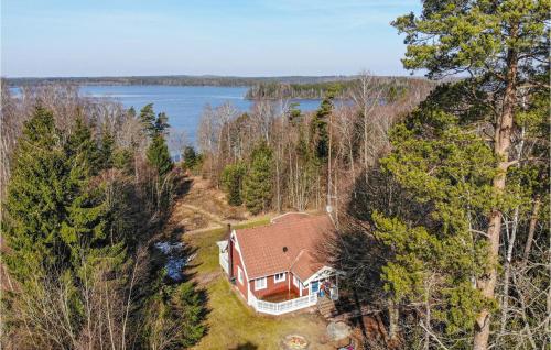 an overhead view of a house in the woods at Awesome Home In Annerstad With Sauna in Romborna