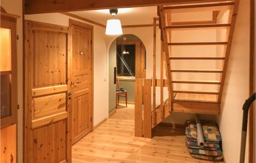 a room with a bunk bed and a ladder at Awesome Home In Annerstad With Sauna in Romborna